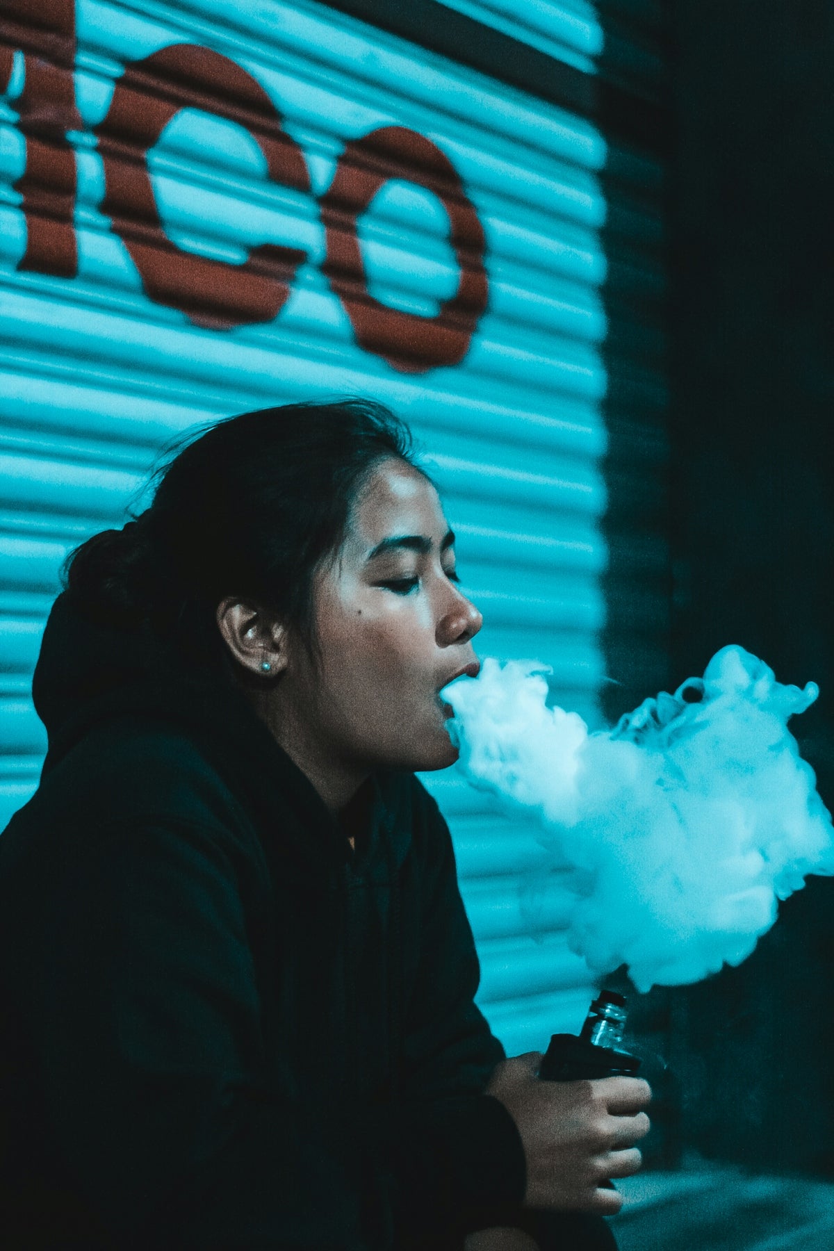 woman in black shirt vaping